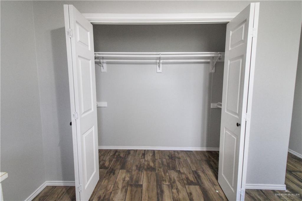 21412 Rusty Lane Harlingen, TX 78552 - Photo 21 of 35 a view of walk in closet with wooden floor