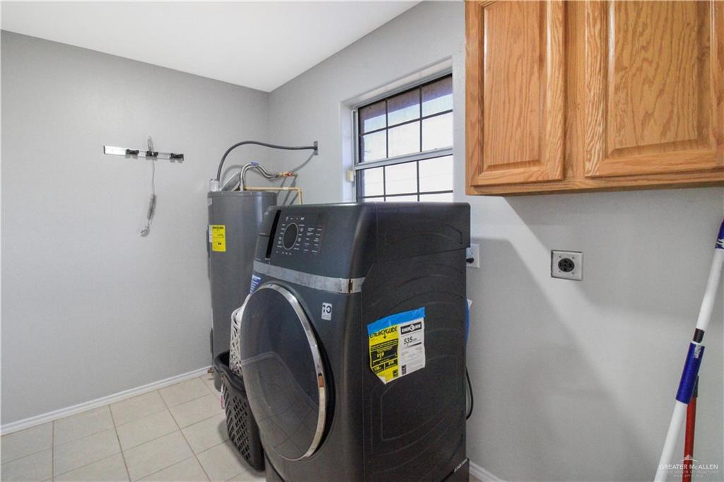 21412 Rusty Lane Harlingen, TX 78552 - Photo 24 of 35 a bathroom with a sink and a mirror
