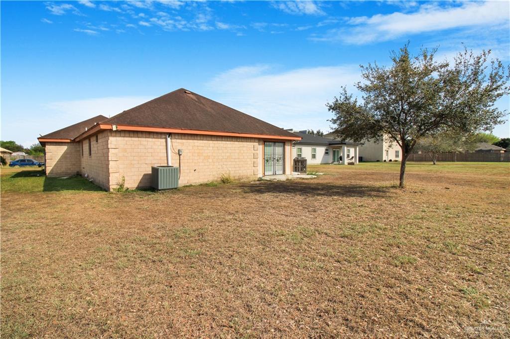 21412 Rusty Lane Harlingen, TX 78552 - Photo 26 of 35 a blue house with yard in front of it