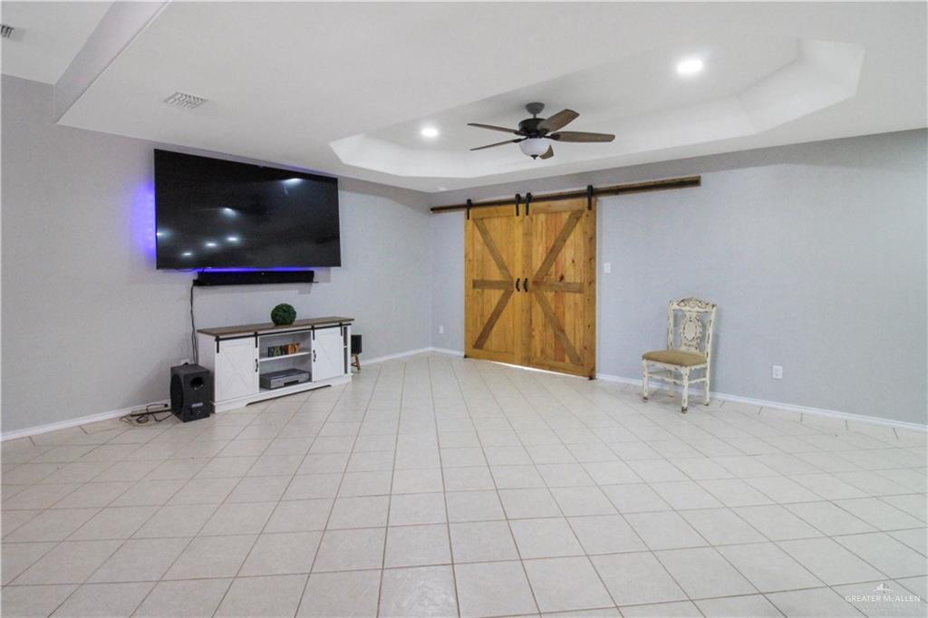 21412 Rusty Lane Harlingen, TX 78552 - Photo 5 of 35 a view of an empty room with a flat screen tv