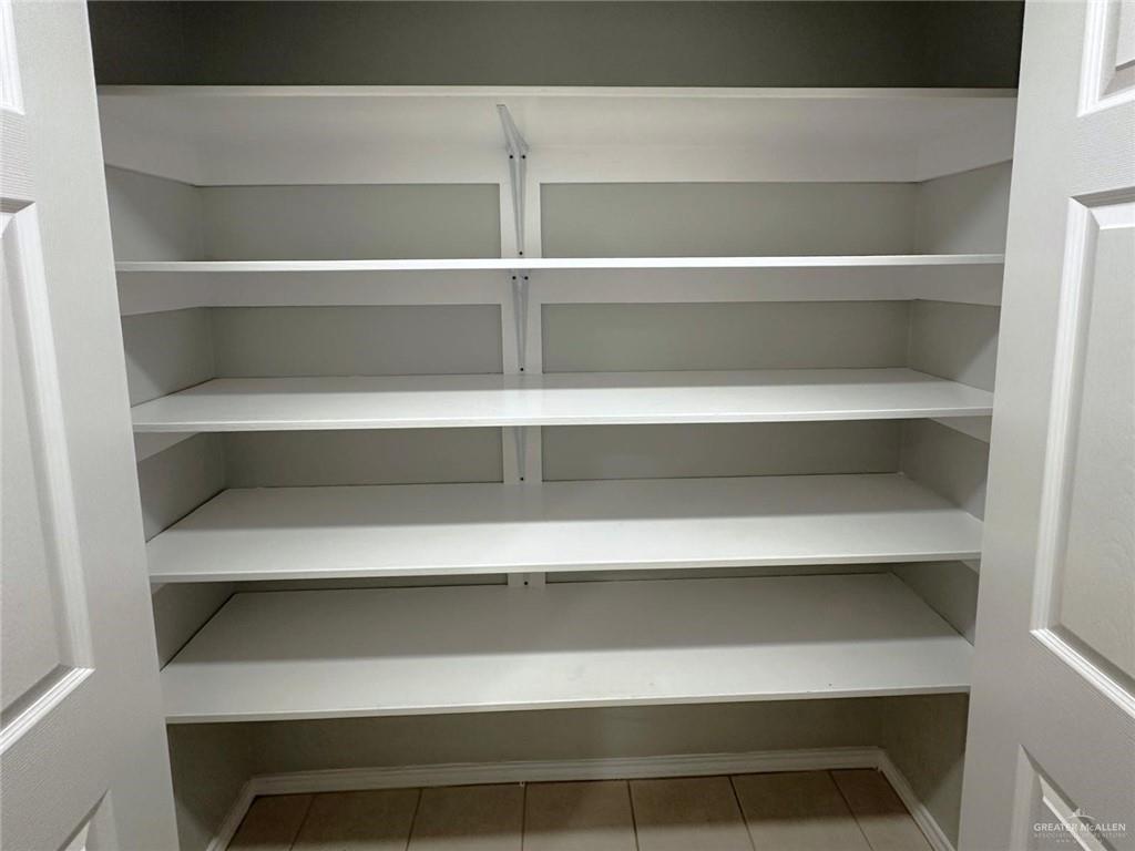 21412 Rusty Lane Harlingen, TX 78552 - Photo 10 of 35 a view of room with shelf