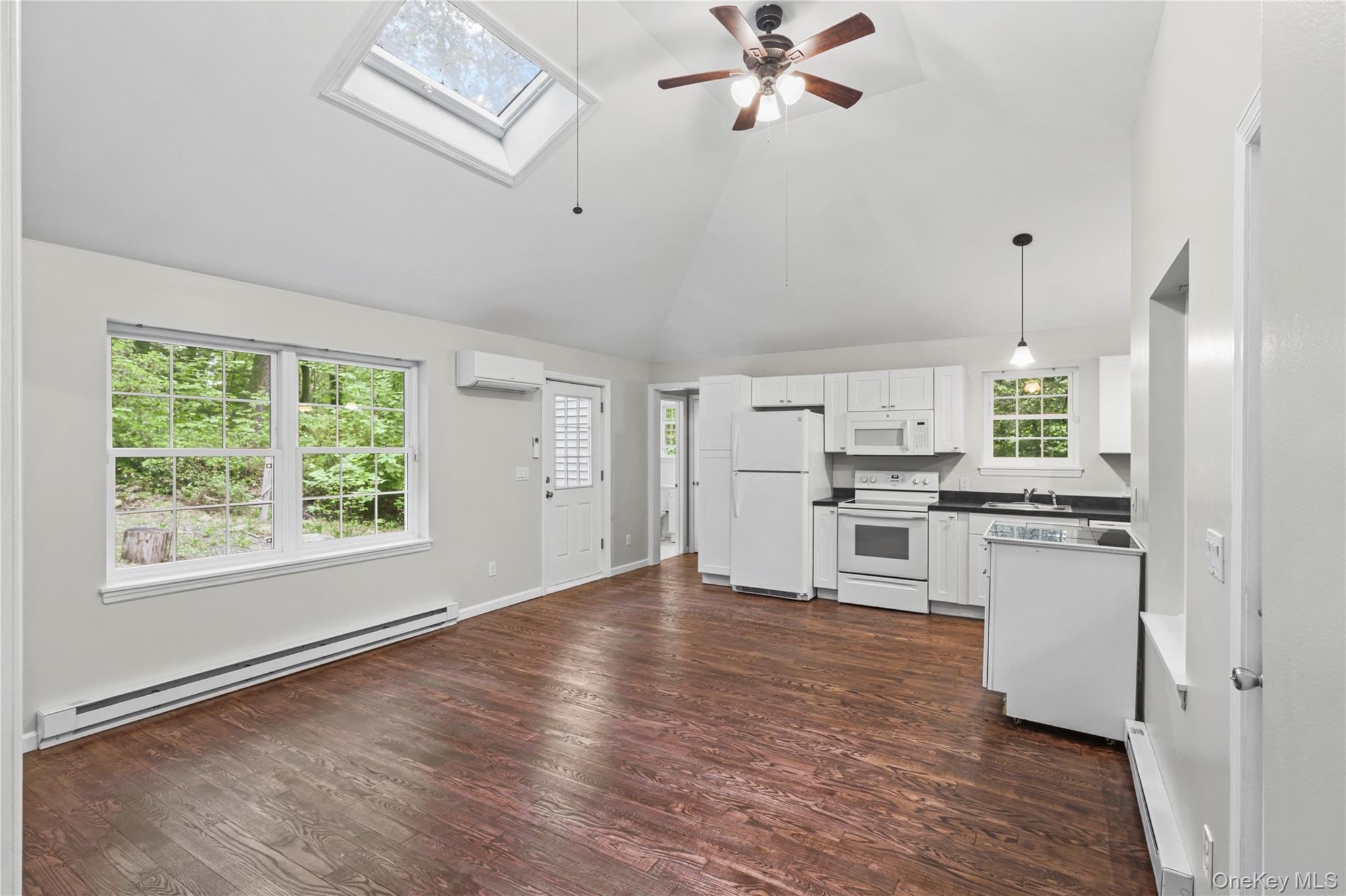 333 Wixon Pond Road Mahopac, NY 10541 - Photo 3 of 18 Open concept living featuring high vaulted ceiling with newly finished hardwood floors and ceiling fans.