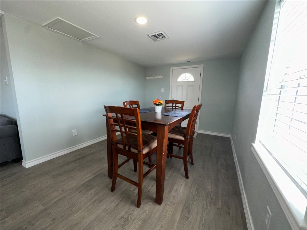 201 Volpe Circle Gregory, TX 78374 - Photo 14 of 29 a view of a dining room with furniture and wooden floor