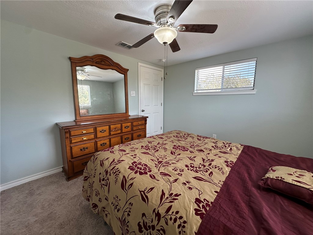 201 Volpe Circle Gregory, TX 78374 - Photo 16 of 29 a bedroom with a bed and a flat screen tv