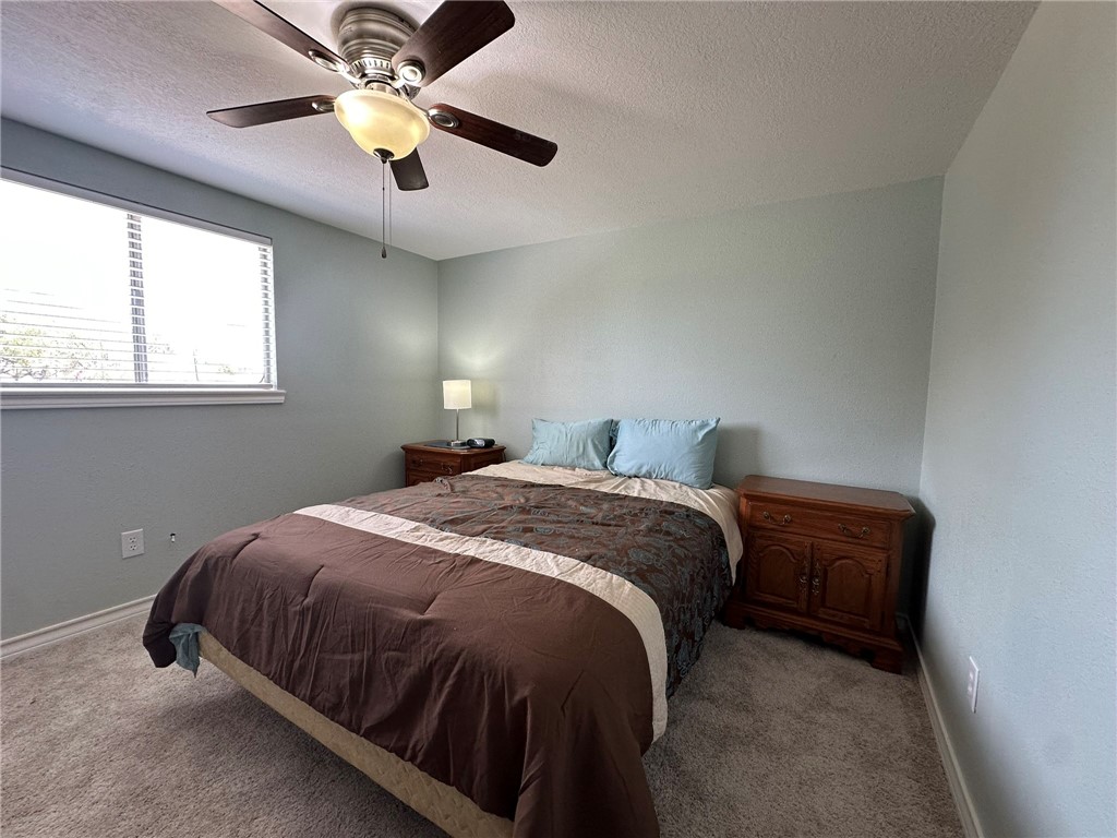 201 Volpe Circle Gregory, TX 78374 - Photo 18 of 29 a bedroom with a bed and window