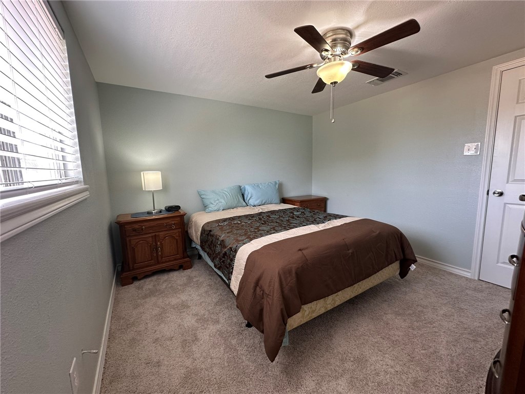 201 Volpe Circle Gregory, TX 78374 - Photo 19 of 29 a bedroom with a bed and window