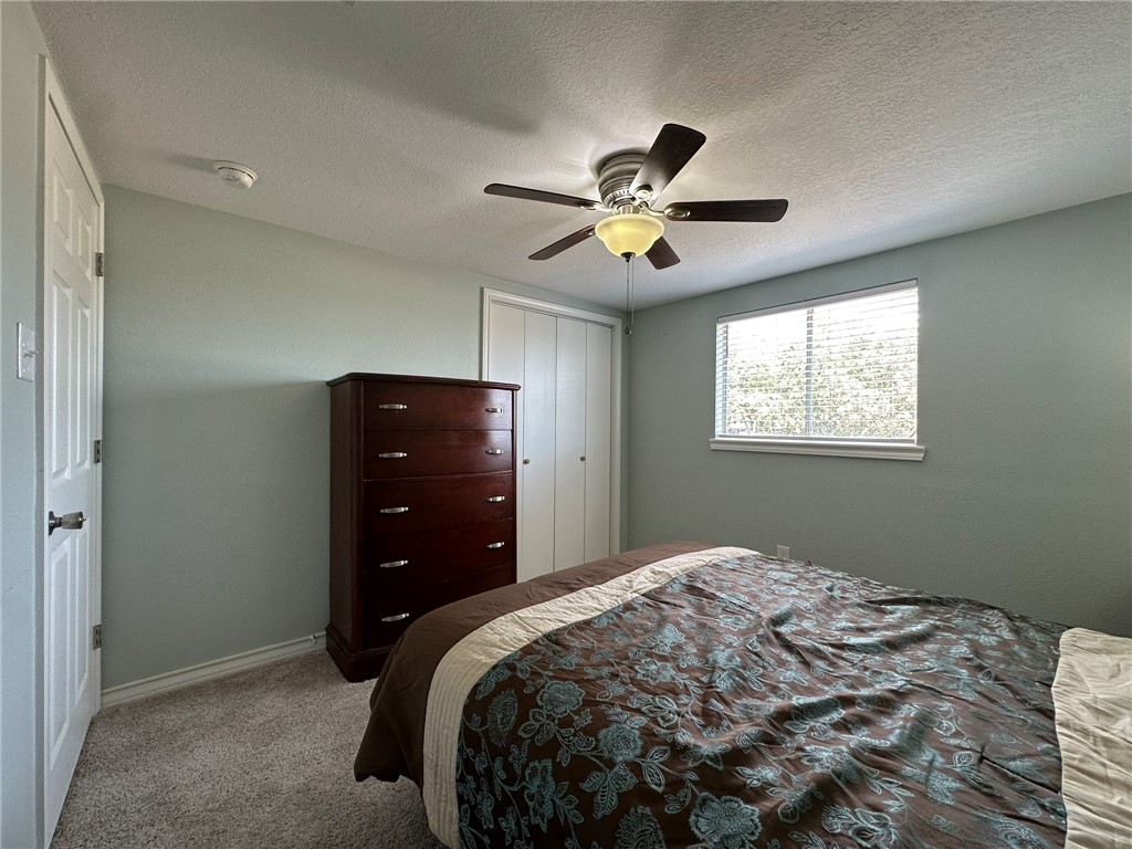 201 Volpe Circle Gregory, TX 78374 - Photo 21 of 29 a bedroom with a bed and a closet