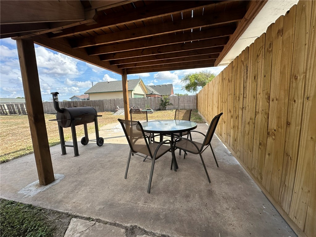 201 Volpe Circle Gregory, TX 78374 - Photo 28 of 29 a view of a porch with furniture and a yard