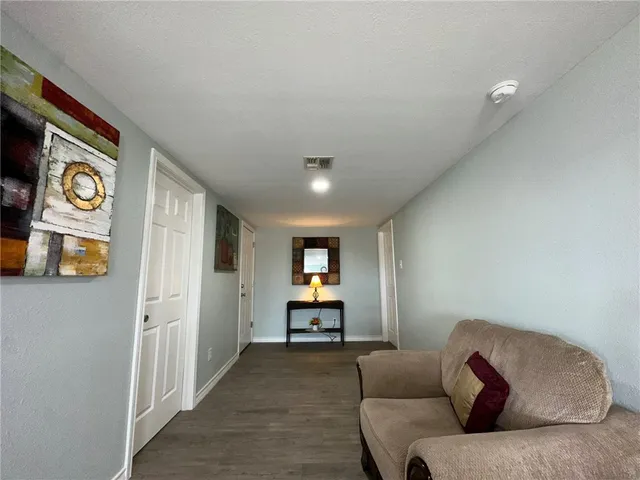a living room with furniture and window