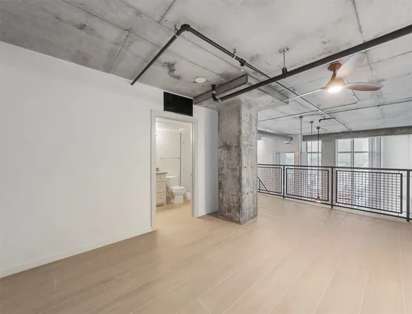 a view of a room with wooden walls