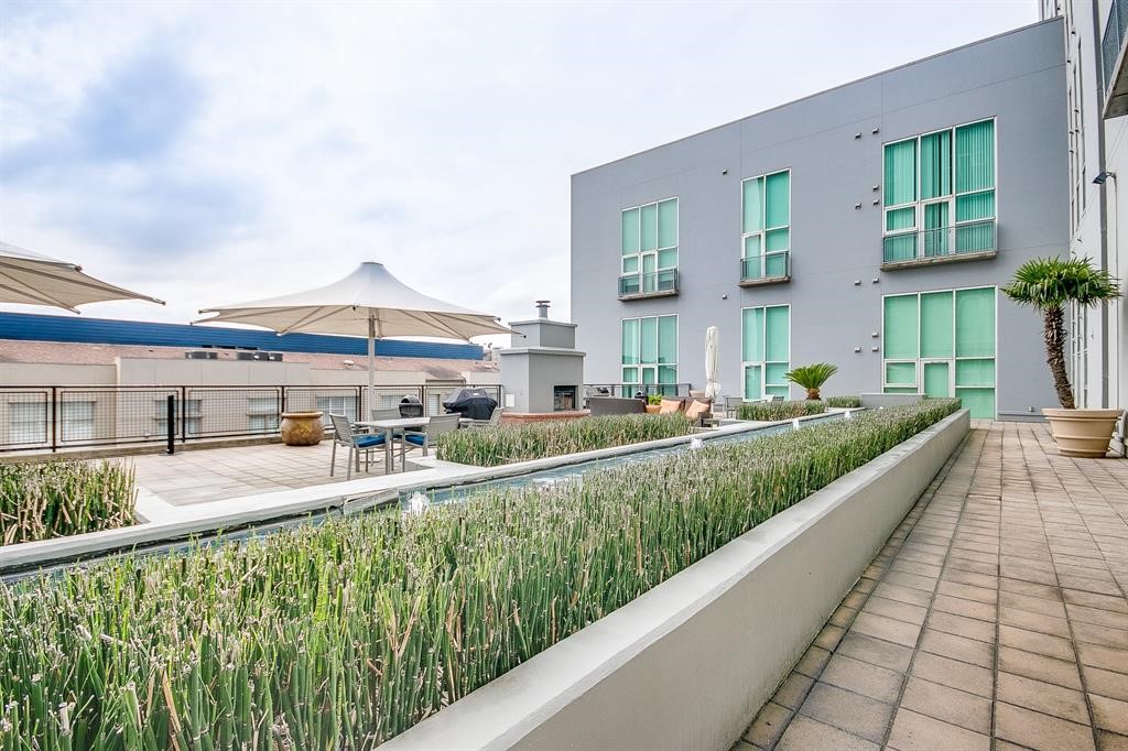 2000 Bagby Street, Unit 5436 Houston, TX 77002 - Photo 27 of 32 a view of a house with a yard and potted plants
