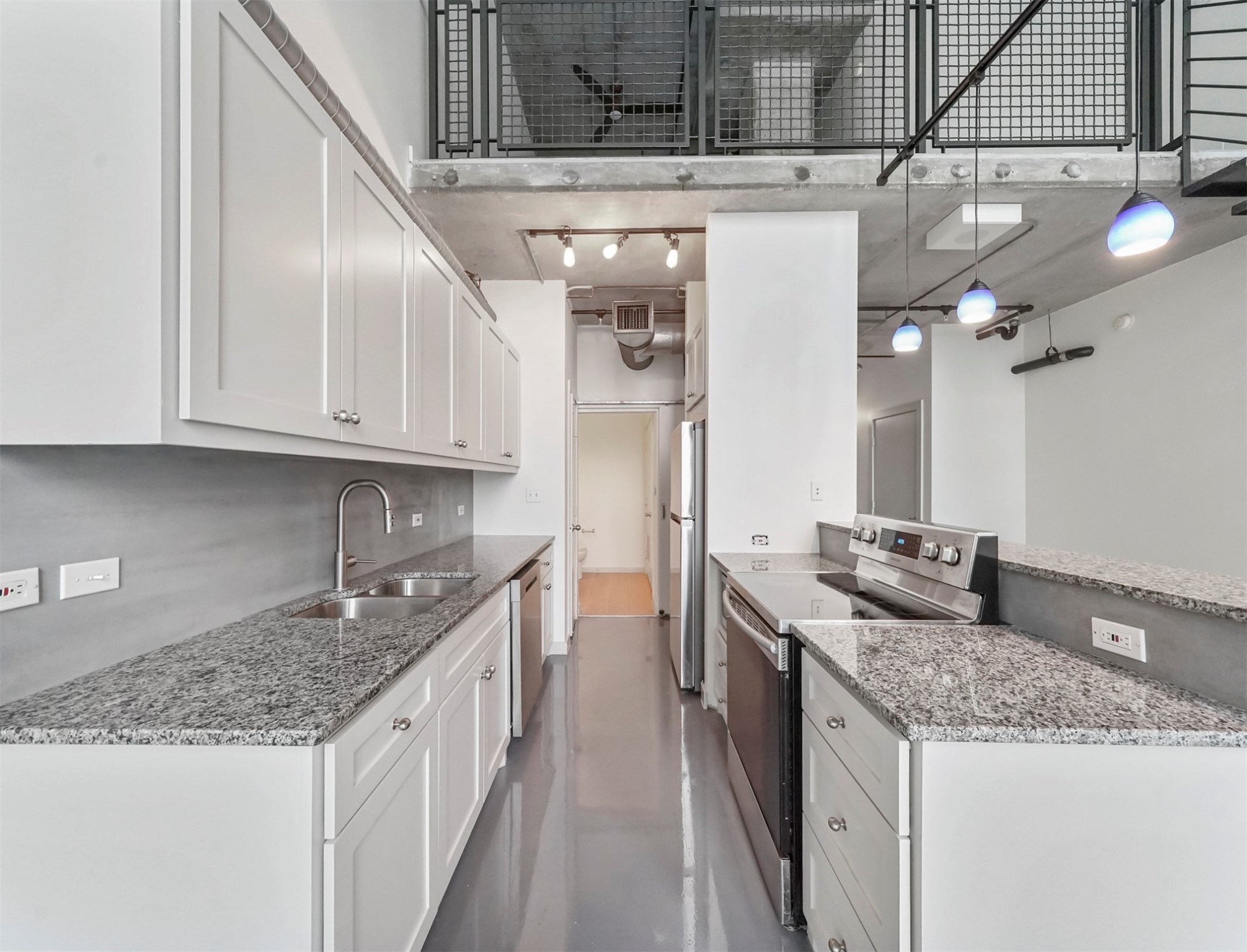 2000 Bagby Street, Unit 5436 Houston, TX 77002 - Photo 8 of 32 a kitchen with stainless steel appliances granite countertop a sink and cabinets