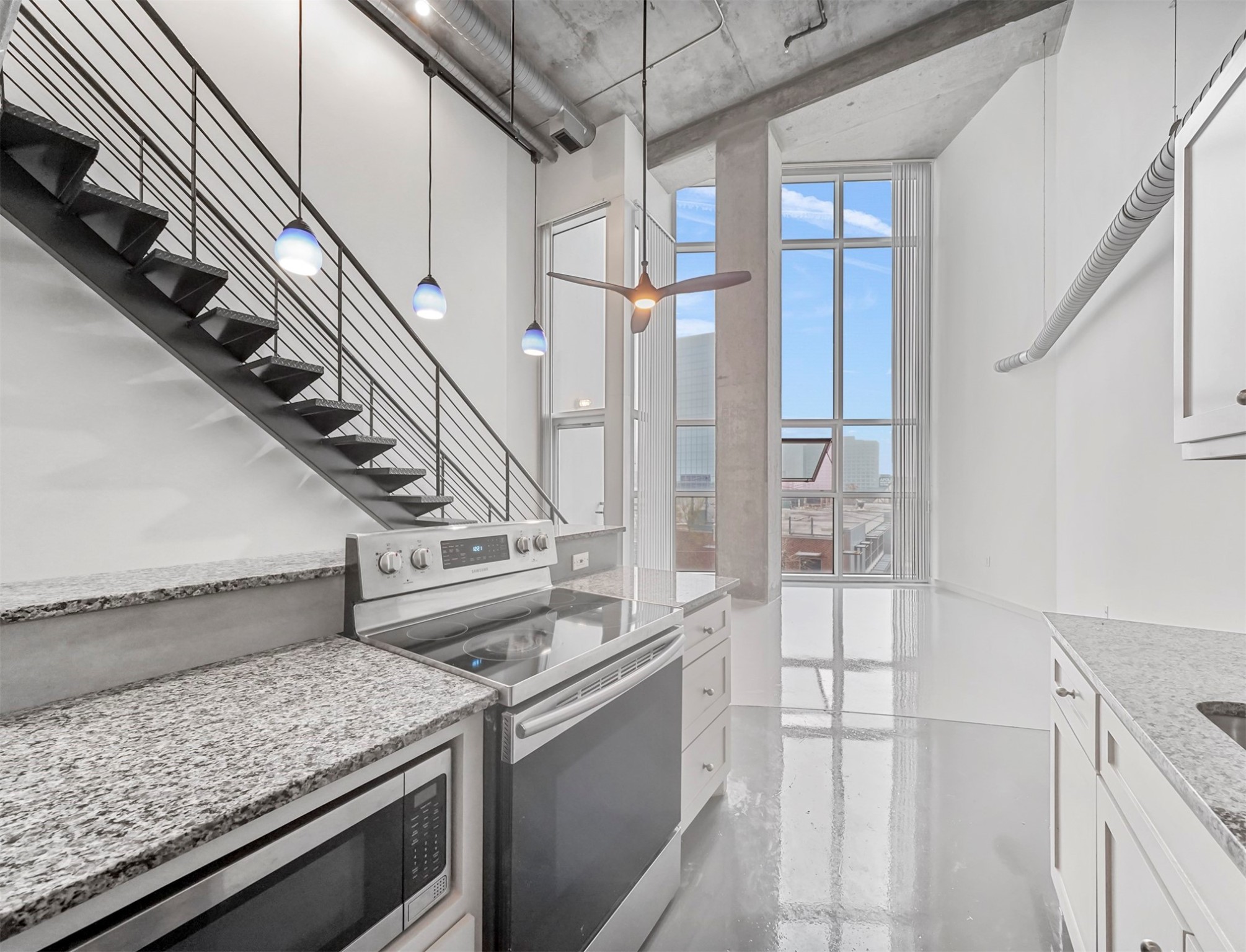 2000 Bagby Street, Unit 5436 Houston, TX 77002 - Photo 10 of 32 a view of a kitchen with a sink and refrigerator