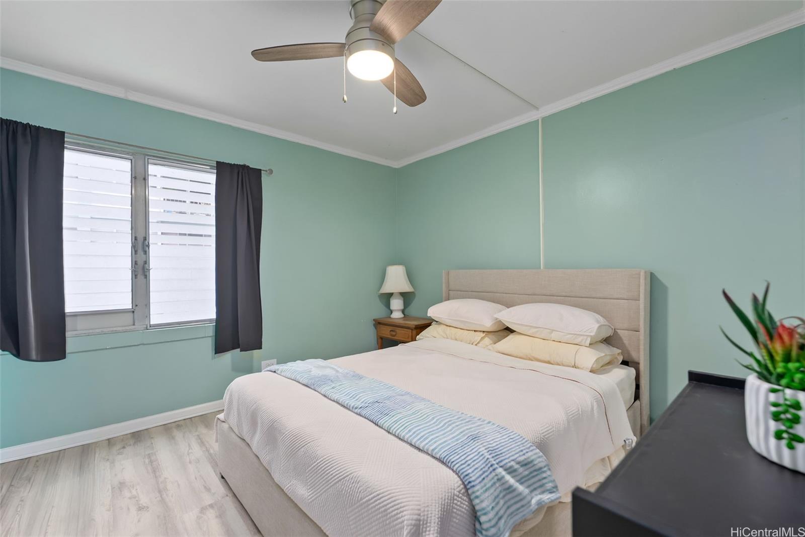 45-535 Luluku Road, Unit G3 Kaneohe, HI 96744 - Photo 15 of 25 a bedroom with a bed and a window
