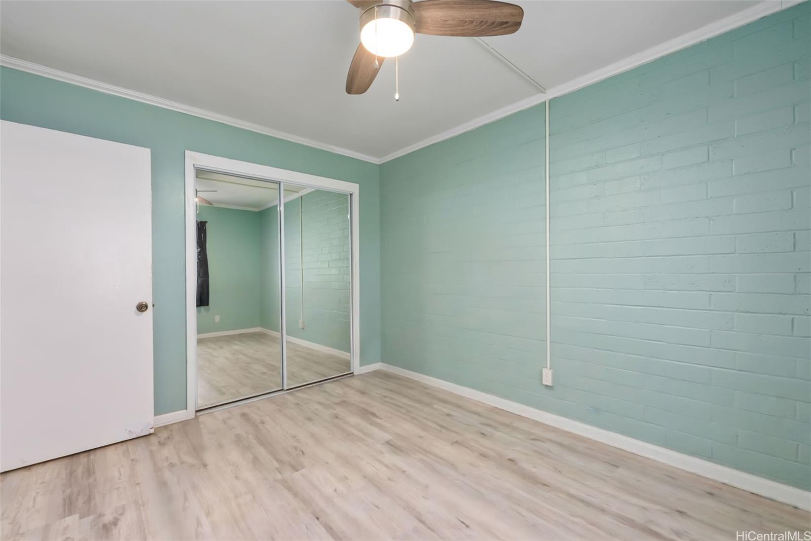 45-535 Luluku Road, Unit G3 Kaneohe, HI 96744 - Photo 17 of 25 a view of empty room with wooden floor