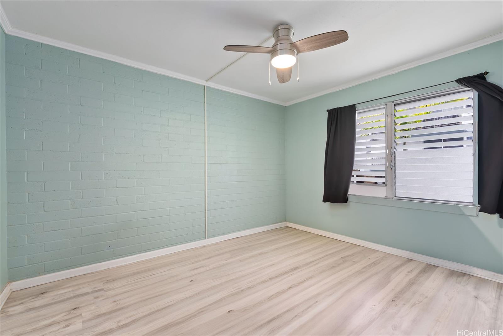45-535 Luluku Road, Unit G3 Kaneohe, HI 96744 - Photo 18 of 25 wooden floor in an empty room with a window