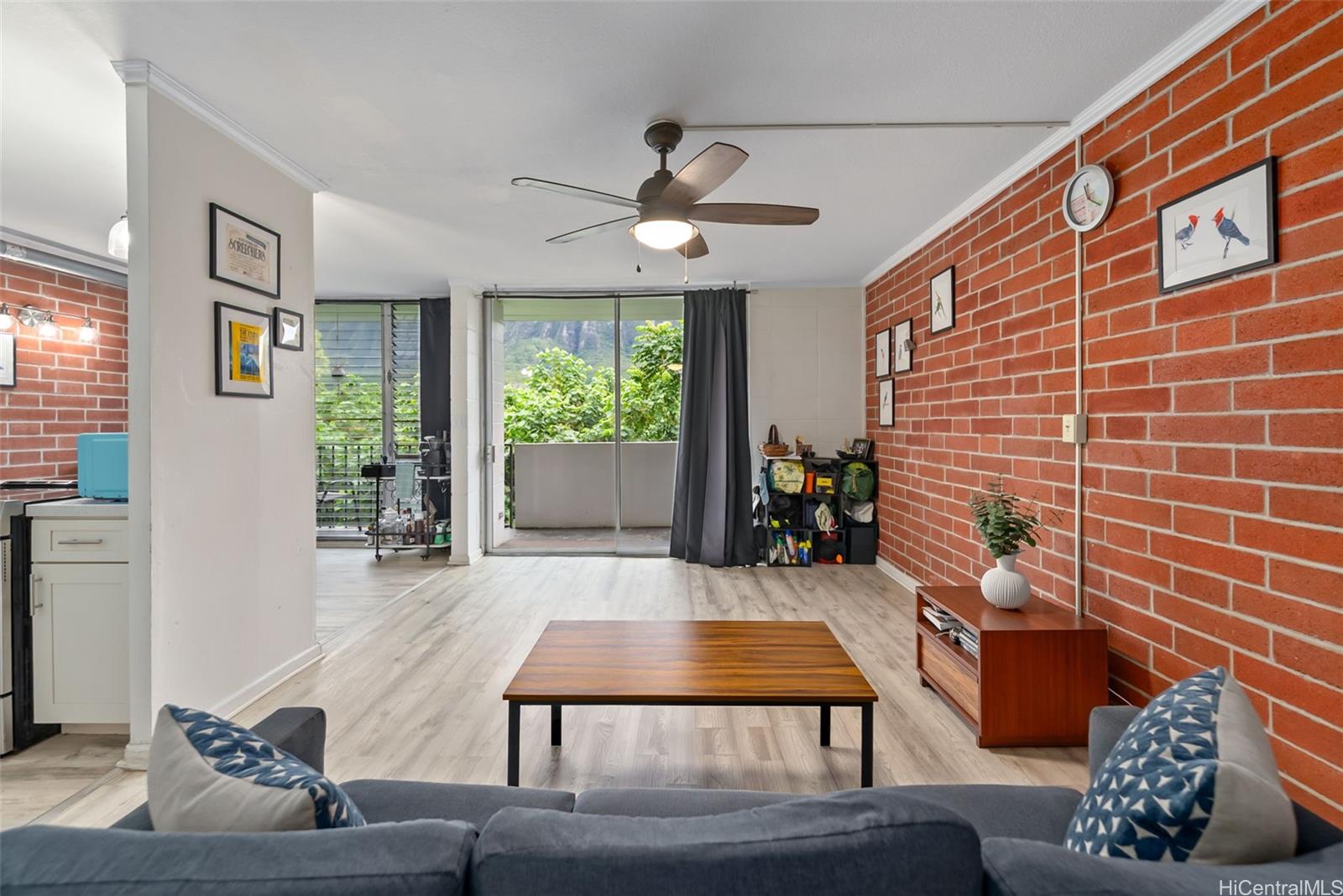 45-535 Luluku Road, Unit G3 Kaneohe, HI 96744 - Photo 2 of 25 a living room with furniture and a potted plant