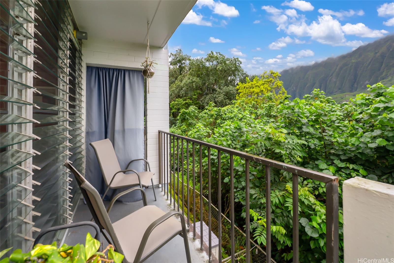 45-535 Luluku Road, Unit G3 Kaneohe, HI 96744 - Photo 8 of 25 a view of a balcony with chairs