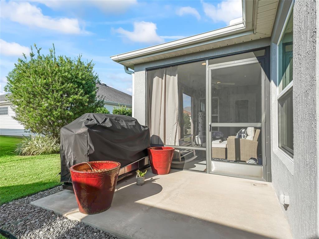 3812 Nottingham Loop The Villages, FL 32163 - Photo 17 of 30 a building outdoor space with patio furniture and garden