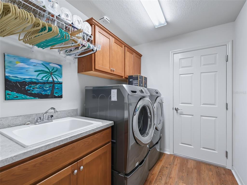 3812 Nottingham Loop The Villages, FL 32163 - Photo 24 of 30 a utility room with dryer and washer