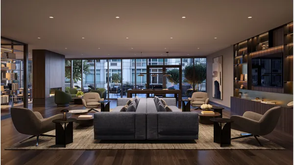 a living room with furniture and a floor to ceiling window