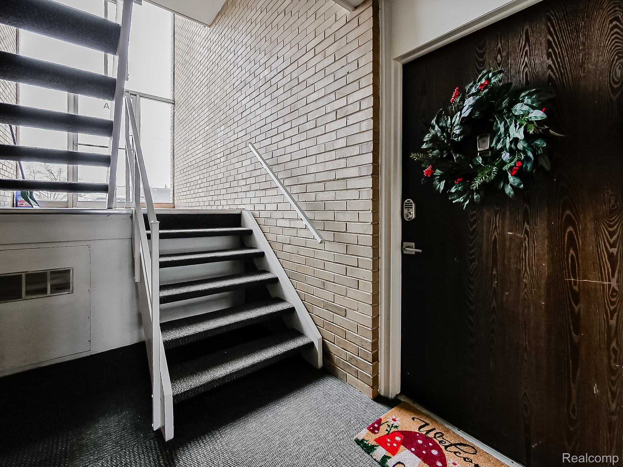 4905 South Crooks Road Royal Oak, MI 48073 - Photo 20 of 28 Staircase with brick wall