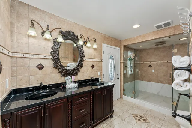 a bathroom with a mirror and a sink