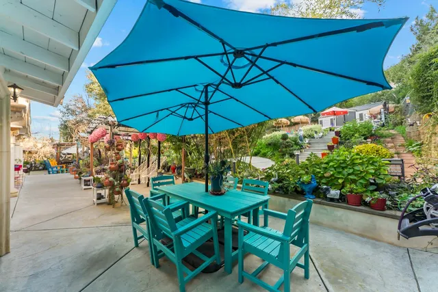 a patio with a patio table and chairs