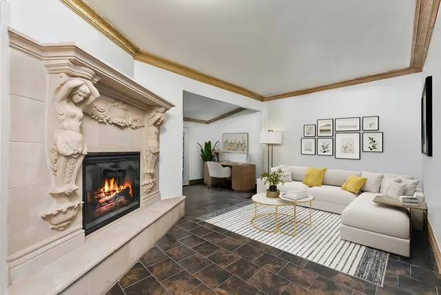 a living room with furniture and a fireplace