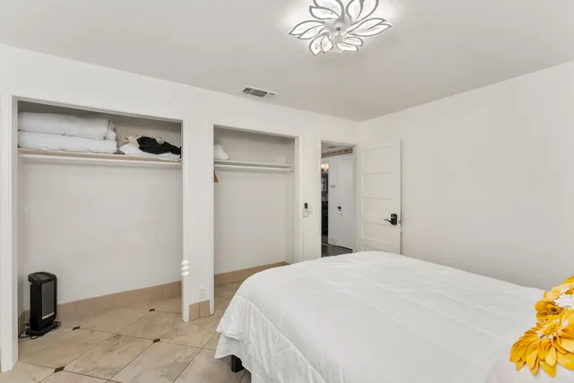 a bedroom with a bed and a table