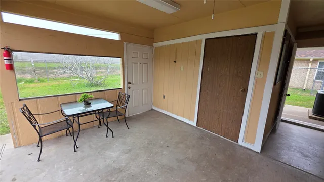 a view of a room with furniture window and wooden floor