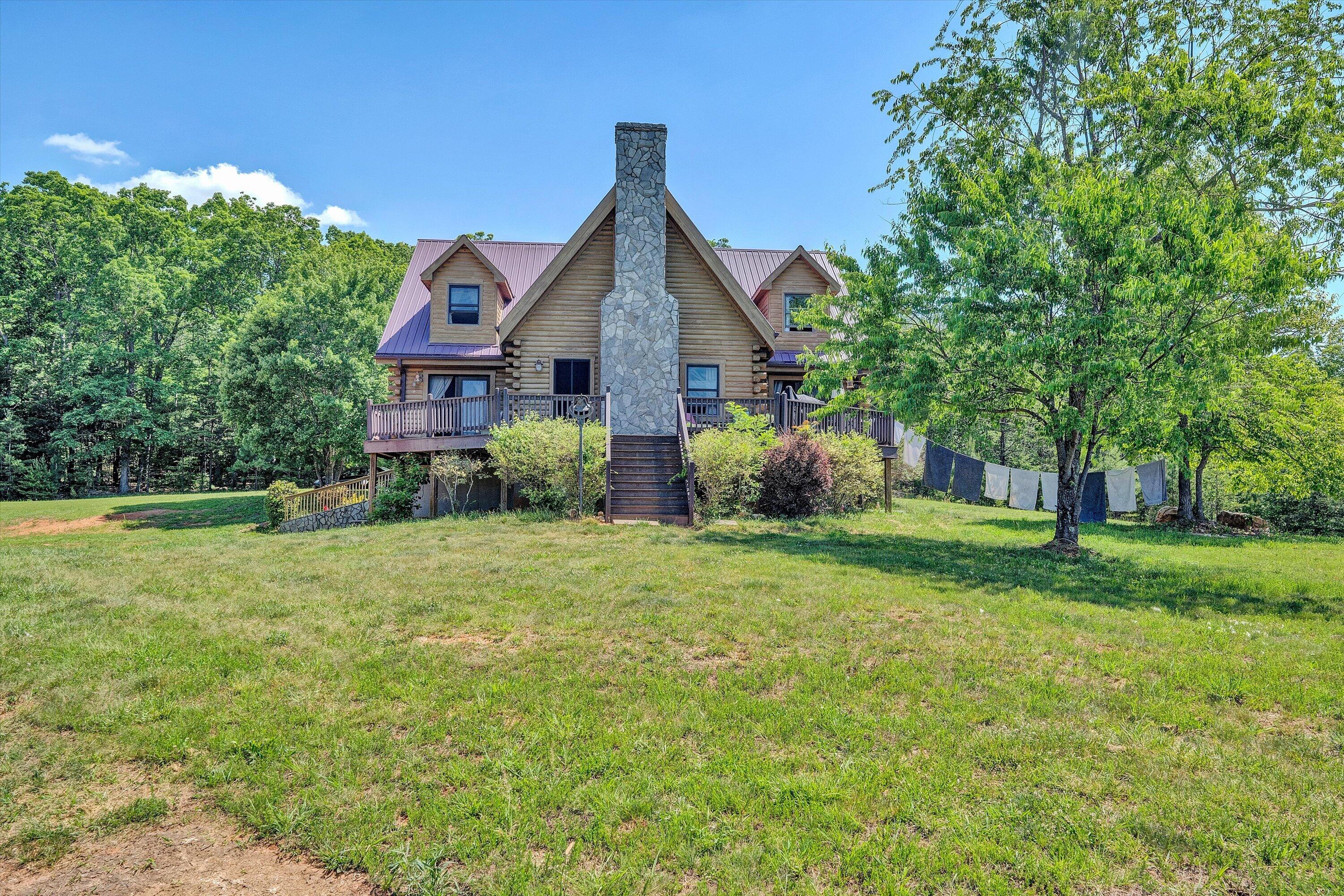 180 Thompson Ridge Circle Ferrum, VA 24088 - Photo 3 of 74 a front view of a house with garden