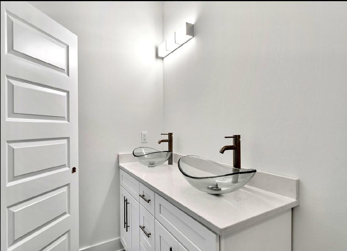 117 Buckeye Street DeFuniak Springs, FL 32433 - Photo 15 of 26 a bathroom with a sink and a mirror