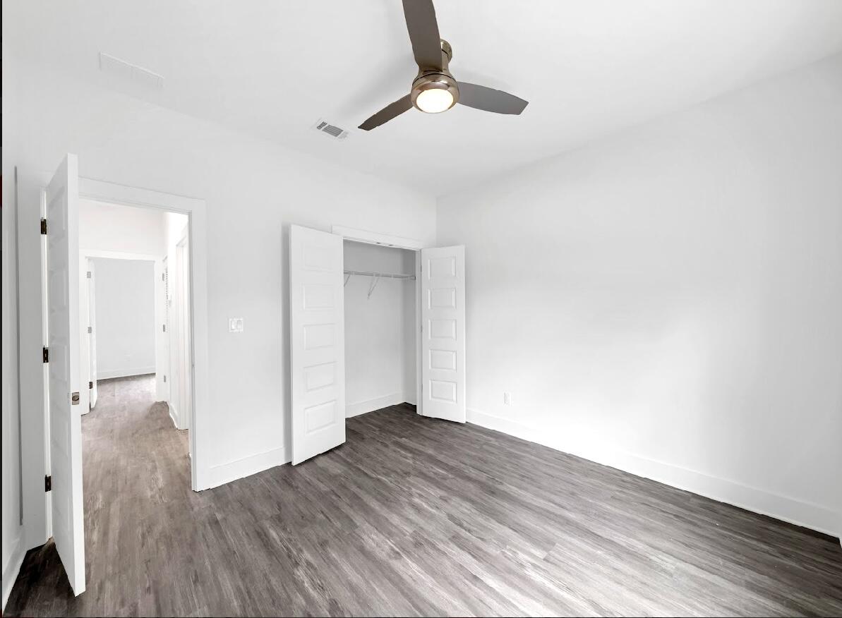 117 Buckeye Street DeFuniak Springs, FL 32433 - Photo 21 of 26 a view of hallway with wooden floor