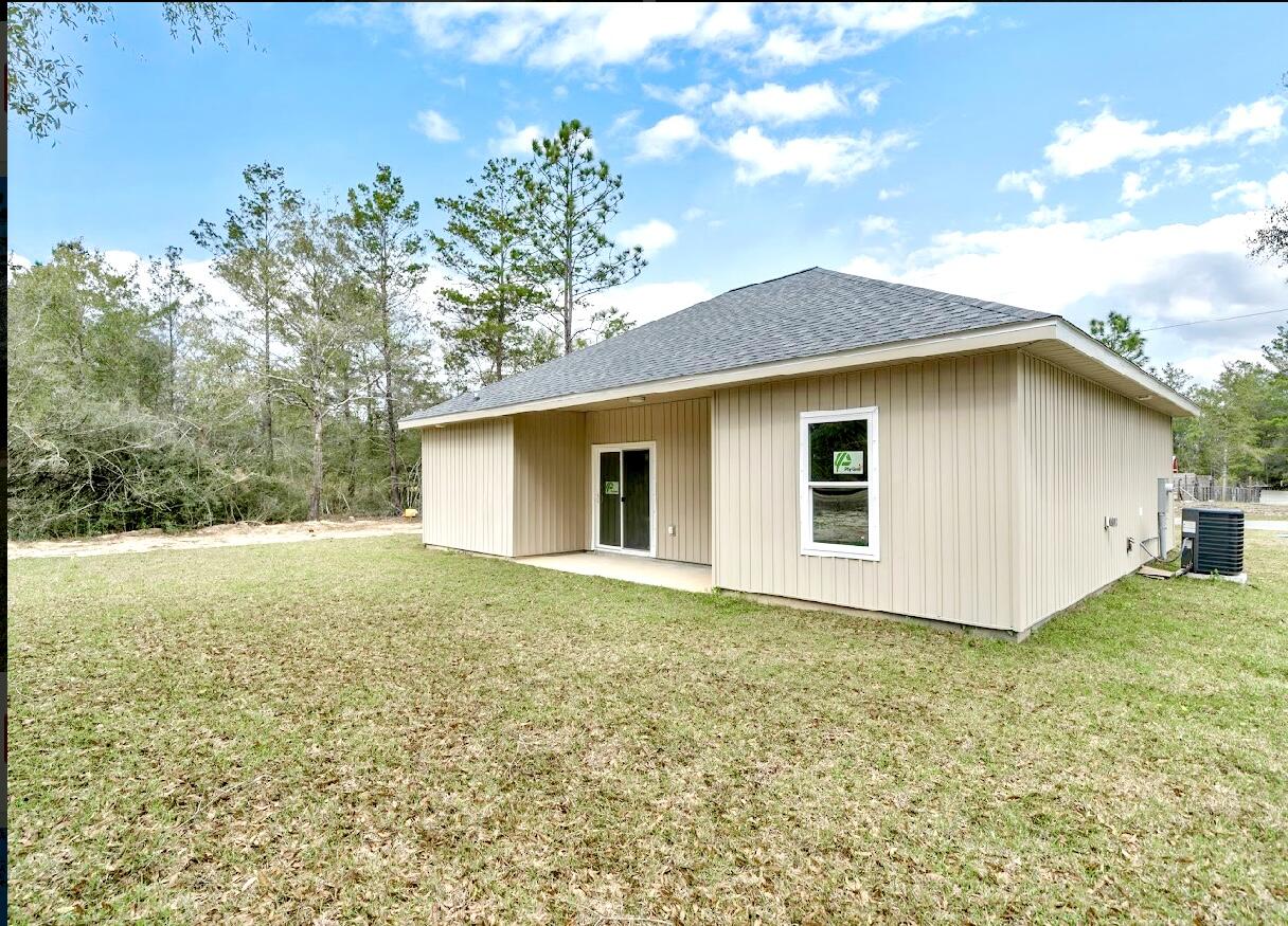 117 Buckeye Street DeFuniak Springs, FL 32433 - Photo 26 of 26 a view of backyard of house with green space