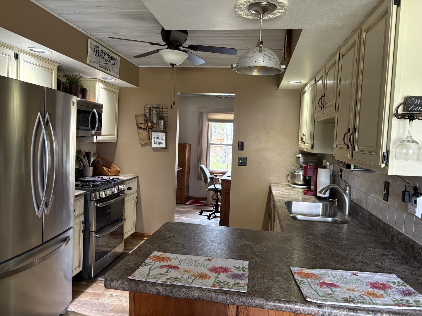 5212 South Mill Pond Road Rochelle, IL 61068 - Photo 15 of 66 a kitchen with stainless steel appliances granite countertop a refrigerator and a sink