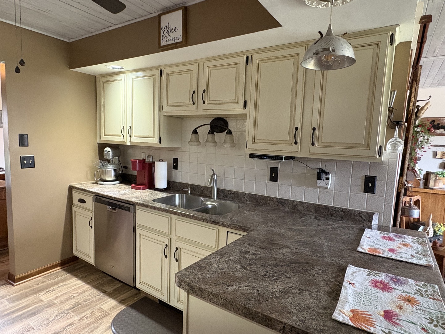 5212 South Mill Pond Road Rochelle, IL 61068 - Photo 17 of 66 a kitchen with stainless steel appliances granite countertop a sink and cabinets