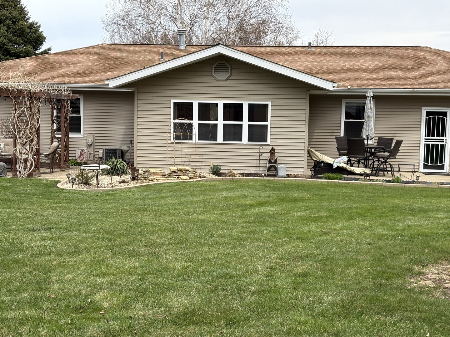 5212 South Mill Pond Road Rochelle, IL 61068 - Photo 61 of 66 a front view of house with yard and outdoor seating
