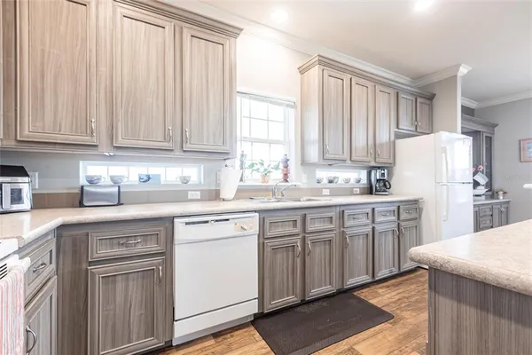 a kitchen with appliances cabinets and a sink