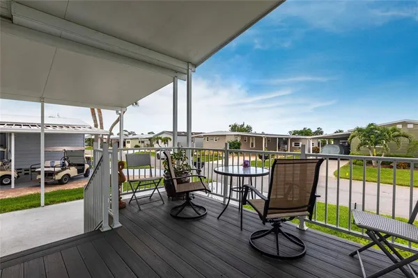 a view of a chairs and table in patio