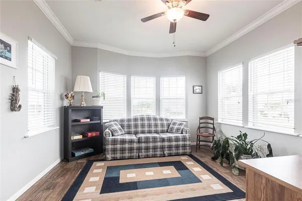 a living room with a couch next to a window