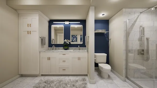 a bathroom with a toilet a sink and glass door