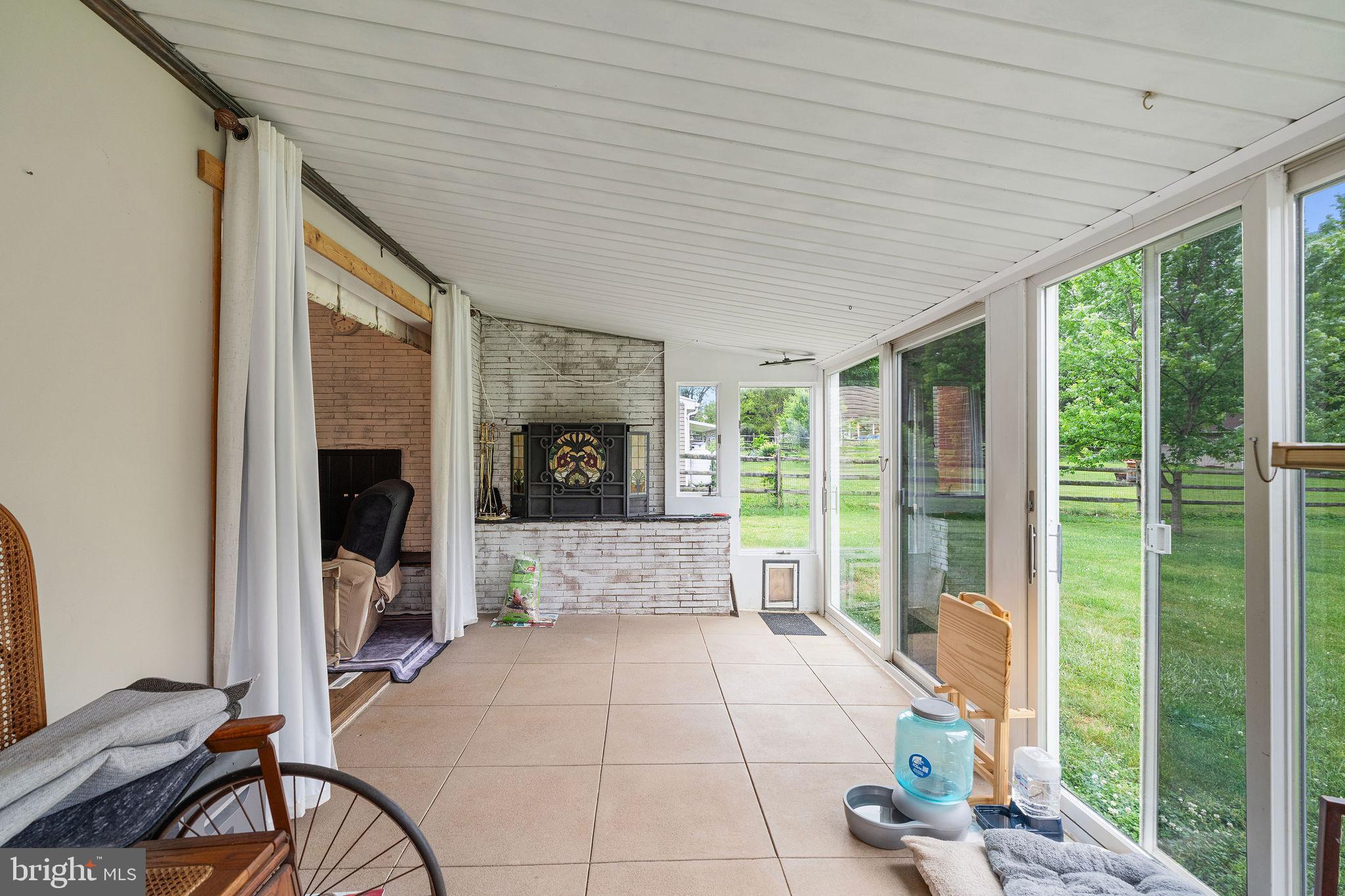 6605 Mt Vista Road Kingsville, MD 21087 - Photo 20 of 54 a spacious bedroom with a large bed and a fireplace