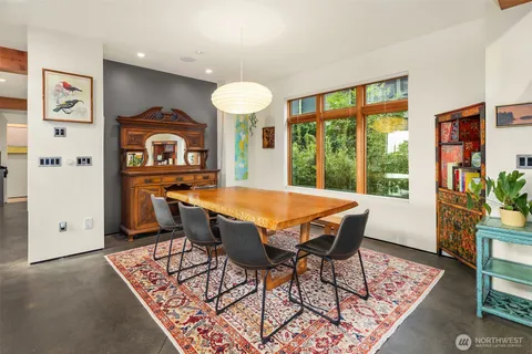a view of a dining room with furniture window and wooden floor
