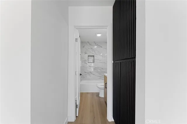 a bathroom with a glass shower door