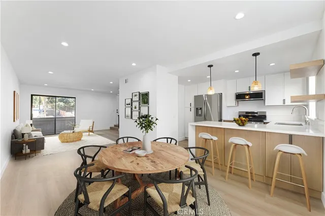 a view of a dining room with furniture and window