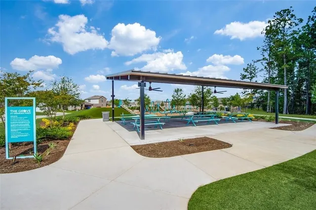 a view of a backyard with swimming pool