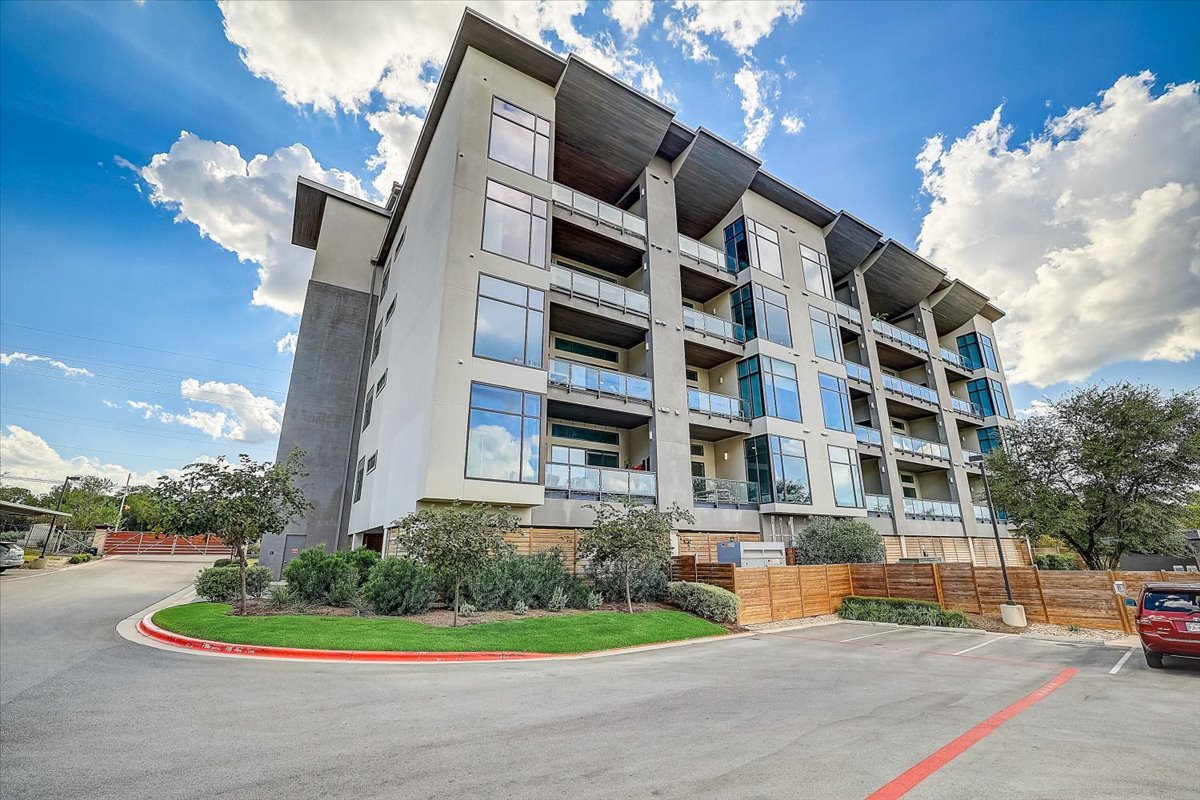5921 Hiline Road, Unit 1204 Austin, TX 78734 - Photo 1 of 36 View of apartment building / complex with uncovered parking