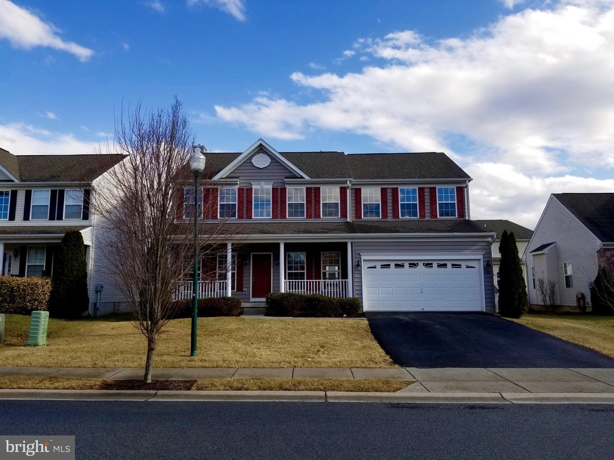 54 Watercourse Drive Ranson, WV 25438 - Photo 2 of 30 a front view of a house with garden