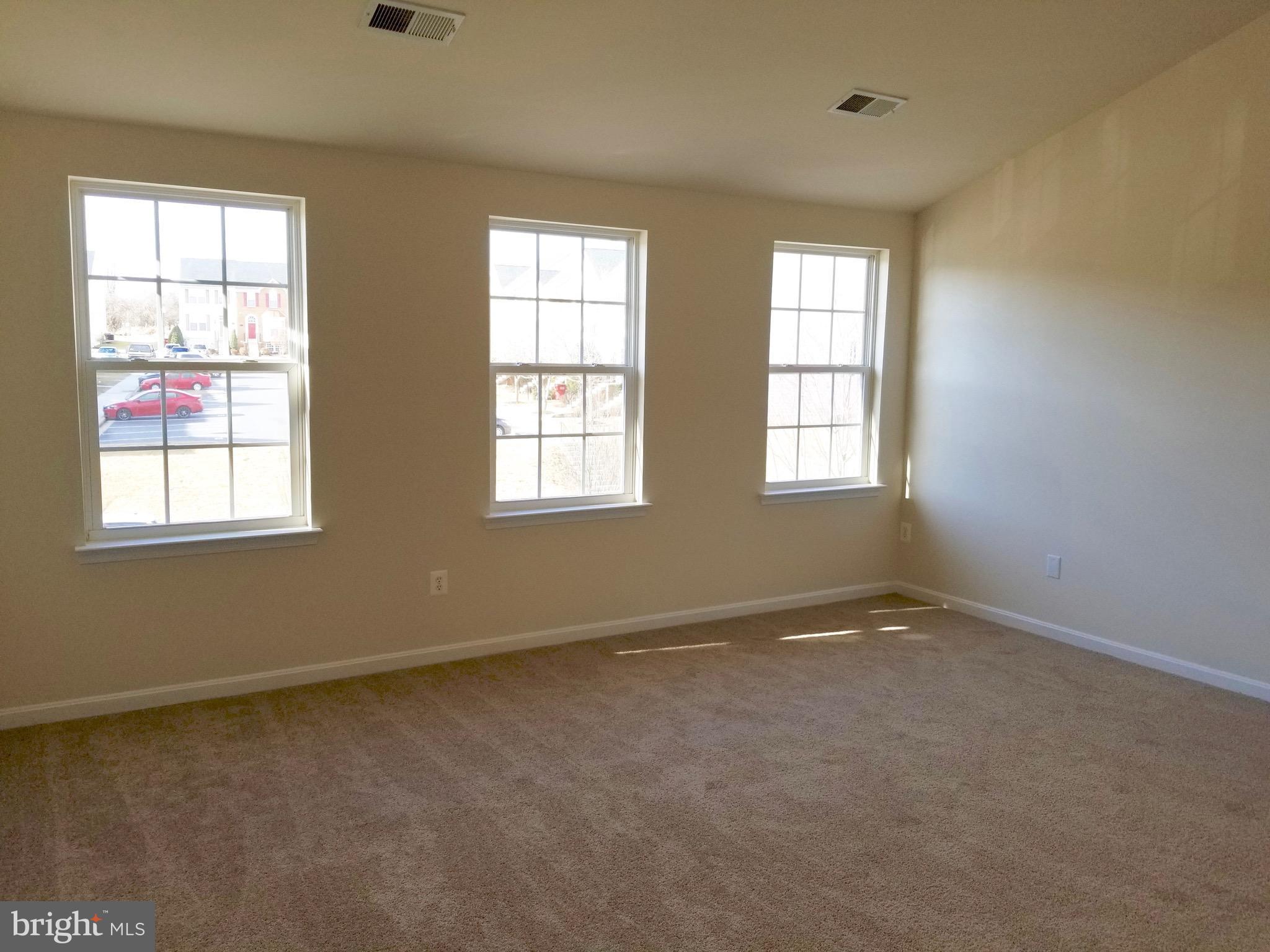 54 Watercourse Drive Ranson, WV 25438 - Photo 14 of 30 an empty room with windows